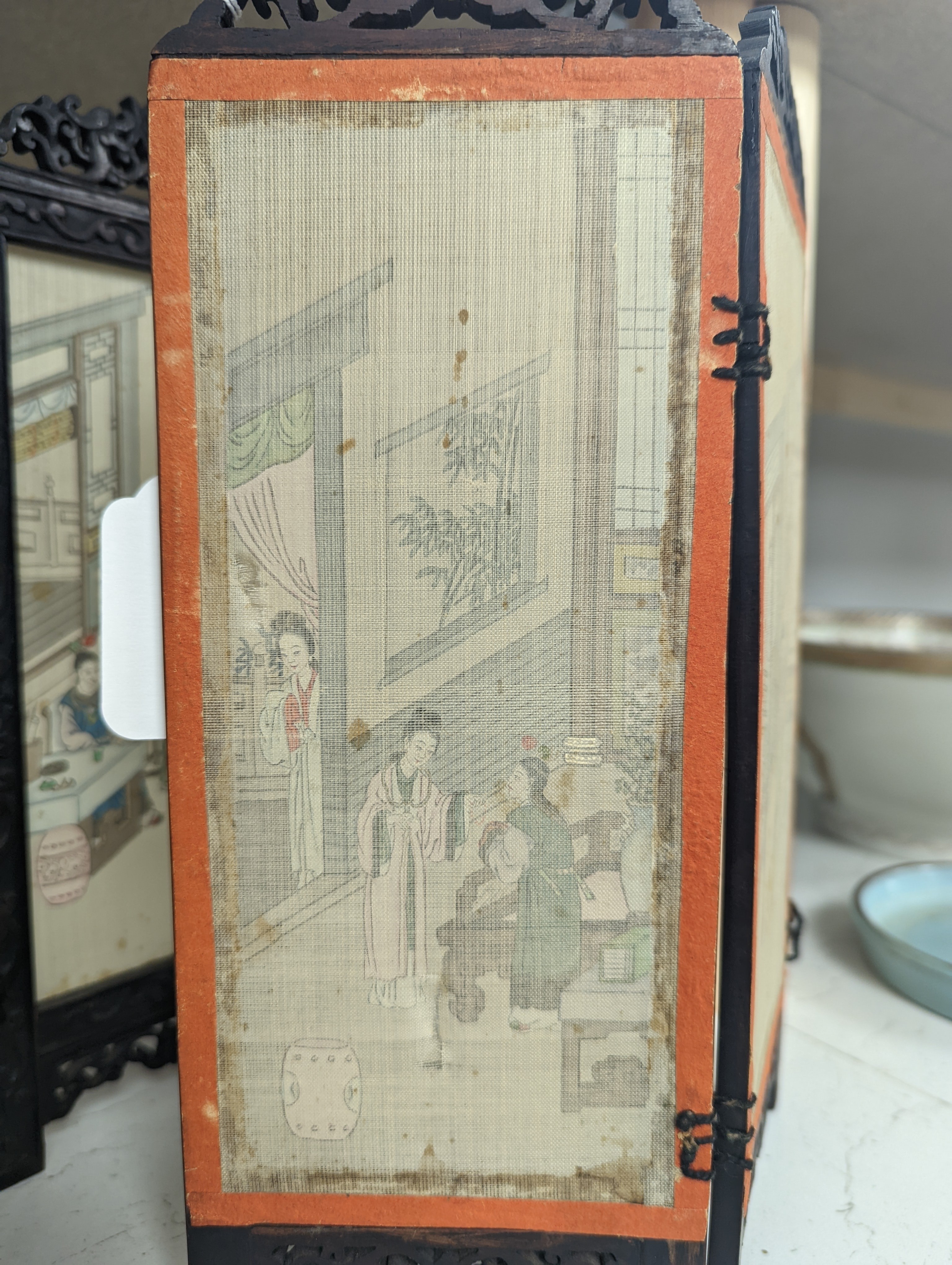 A Chinese hardwood framed painted silk four fold miniature screen, inset with painted silk panels, 28cm